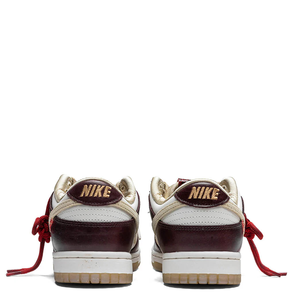 Womens Dunk Low Year Of The Snake Sail Team Gold Sail Burgundy Crush